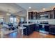 Stylish kitchen and dining area with modern fixtures, stainless appliances, and hardwood floors at 15252 N 100Th St # 2157, Scottsdale, AZ 85260