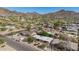 Scenic aerial view showcasing the neighborhood with stunning mountain views and lush greenery, providing a serene setting at 1541 E Cinnabar Ave, Phoenix, AZ 85020