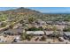 Expansive aerial view of a residential neighborhood offering mountain views and lush greenery, enhancing the community's appeal at 1541 E Cinnabar Ave, Phoenix, AZ 85020