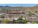 Residential neighborhood aerial shot with multi-story apartments surrounded by green trees. Carports provide shade for parked vehicles at 1541 E Cinnabar Ave, Phoenix, AZ 85020