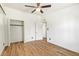 Spacious bedroom featuring wood floors, ceiling fan, closet and natural light at 1541 E Cinnabar Ave, Phoenix, AZ 85020