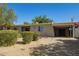 Charming single-story home featuring a brick exterior, well-maintained landscaping, and covered parking at 1541 E Cinnabar Ave, Phoenix, AZ 85020