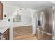 Modern kitchen with stainless steel refrigerator and updated cabinets with archway to the living room at 1541 E Cinnabar Ave, Phoenix, AZ 85020