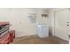 Laundry area featuring appliances, overhead storage and natural light at 1541 E Cinnabar Ave, Phoenix, AZ 85020