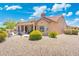 This property features a private backyard with covered patio, desert landscaping and privacy at 15502 W Agua Linda Ln, Surprise, AZ 85374