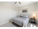 Comfortable bedroom with neutral tones, plush carpet, and ample natural light at 15502 W Agua Linda Ln, Surprise, AZ 85374