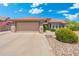 Inviting single-story home showcasing a neutral color palette, low maintenance desert landscaping, and a spacious two-car garage at 15502 W Agua Linda Ln, Surprise, AZ 85374