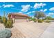A beautiful home with a three car garage, desert landscaping, and a tile roof at 15502 W Agua Linda Ln, Surprise, AZ 85374