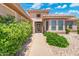 Attractive front entrance boasting desert landscaping, a walkway, and a security screen door at 15502 W Agua Linda Ln, Surprise, AZ 85374
