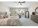 Serene main bedroom with large bay windows offering plentiful natural light and neutral tones throughout at 15502 W Agua Linda Ln, Surprise, AZ 85374