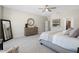 Serene main bedroom featuring a dresser, walk-in closet, and neutral tones for a relaxing atmosphere at 15502 W Agua Linda Ln, Surprise, AZ 85374