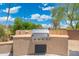 Outdoor kitchen with a stainless steel gas grill, perfect for outdoor gatherings at 15502 W Agua Linda Ln, Surprise, AZ 85374