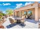 This is a great covered patio for outdoor entertaining with dining and seating areas, along with a water feature at 15502 W Agua Linda Ln, Surprise, AZ 85374