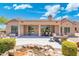 Enjoy outdoor living on the covered patio with a water feature and ample seating space at 15502 W Agua Linda Ln, Surprise, AZ 85374