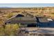 Expansive property featuring a desert landscape with mature cacti and shrubs, as well as views of the surrounding mountains and community at 15612 S Tuthill Rd, Buckeye, AZ 85326