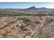 An aerial perspective reveals the property's desert landscape, peaceful privacy and surrounding landscape at 15612 S Tuthill Rd, Buckeye, AZ 85326