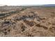 An aerial perspective showcasing the property with a private lot and surrounding desert landscape at 15612 S Tuthill Rd, Buckeye, AZ 85326