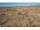 Expansive aerial view of a desert home and surrounding desert landscape at 15612 S Tuthill Rd, Buckeye, AZ 85326