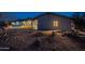 Backyard area featuring desert landscaping, patio, lawn and covered outdoor grilling area at 15612 S Tuthill Rd, Buckeye, AZ 85326