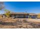 Rear exterior view of a gray single-story home with desert landscaping at 15612 S Tuthill Rd, Buckeye, AZ 85326