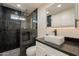 Stylish bathroom featuring a walk-in shower, sleek vanity, and modern fixtures at 15612 S Tuthill Rd, Buckeye, AZ 85326