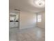 Bathroom featuring dual vanities, modern lighting, and a window at 15612 S Tuthill Rd, Buckeye, AZ 85326