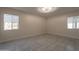 Bright bedroom with two windows providing ample natural light at 15612 S Tuthill Rd, Buckeye, AZ 85326