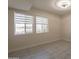 Bedroom filled with natural light from two windows at 15612 S Tuthill Rd, Buckeye, AZ 85326