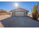 Front of home showing neutral tone and desert landscaping at 15612 S Tuthill Rd, Buckeye, AZ 85326