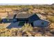 A desert home with fresh gravel landscaping, desert vegetation, and a desert view at 15612 S Tuthill Rd, Buckeye, AZ 85326