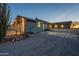 Attractive single-story home with a long driveway and professional landscaping at 15612 S Tuthill Rd, Buckeye, AZ 85326