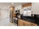 Modern kitchen featuring stainless steel appliances, stylish countertops, and lots of natural light at 15612 S Tuthill Rd, Buckeye, AZ 85326