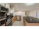 Modern kitchen featuring a spacious island, stainless steel appliances, and plenty of counter space at 15612 S Tuthill Rd, Buckeye, AZ 85326