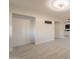 A view into a living space, showing a closet and bathroom vanity at 15612 S Tuthill Rd, Buckeye, AZ 85326
