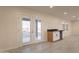 Indoor living space featuring wet bar and sliding door access at 15612 S Tuthill Rd, Buckeye, AZ 85326