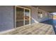 Covered patio with gray textured stucco and black tile at 15612 S Tuthill Rd, Buckeye, AZ 85326
