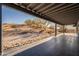 Covered patio with black tile and panoramic desert view at 15612 S Tuthill Rd, Buckeye, AZ 85326