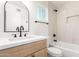 Bright bathroom featuring modern fixtures, neutral tile, and a window for natural light at 1605 W Curry Dr, Chandler, AZ 85224