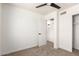 Bedroom featuring a ceiling fan, plush carpet, and ensuite access at 1605 W Curry Dr, Chandler, AZ 85224