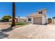 Exterior view of home featuring fresh exterior paint, low maintenance desert landscaping, and attached garage at 1605 W Curry Dr, Chandler, AZ 85224