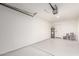 Spacious garage with a water heater, neutral walls, and sealed concrete flooring at 1605 W Curry Dr, Chandler, AZ 85224