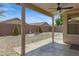 Backyard with covered patio and low-maintenance desert landscaping at 16619 W Cottonwood St, Surprise, AZ 85388