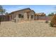 Back of house and backyard with low-maintenance desert landscaping at 16619 W Cottonwood St, Surprise, AZ 85388