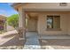 Welcoming front porch with stone accents and a decorative security door at 16619 W Cottonwood St, Surprise, AZ 85388
