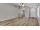 Spacious open-concept living area with hardwood flooring and neutral paint at 16619 W Cottonwood St, Surprise, AZ 85388