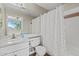 Bathroom features a shower/tub combo with white tile and a modern white vanity at 1701 E Colter St # 147, Phoenix, AZ 85016