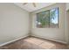 Sunlit bedroom with large window and tile flooring at 1701 E Colter St # 147, Phoenix, AZ 85016