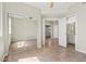 Large bedroom features mirrored closet, ceiling fan and multiple doors at 1701 E Colter St # 147, Phoenix, AZ 85016