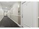 Well-lit hallway with neutral decor leading to individual condo units at 1701 E Colter St # 147, Phoenix, AZ 85016