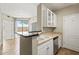 Kitchen sink area with views out to balcony at 1701 E Colter St # 147, Phoenix, AZ 85016